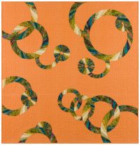Jungle print fabric is used to create the rings on a muted orange background